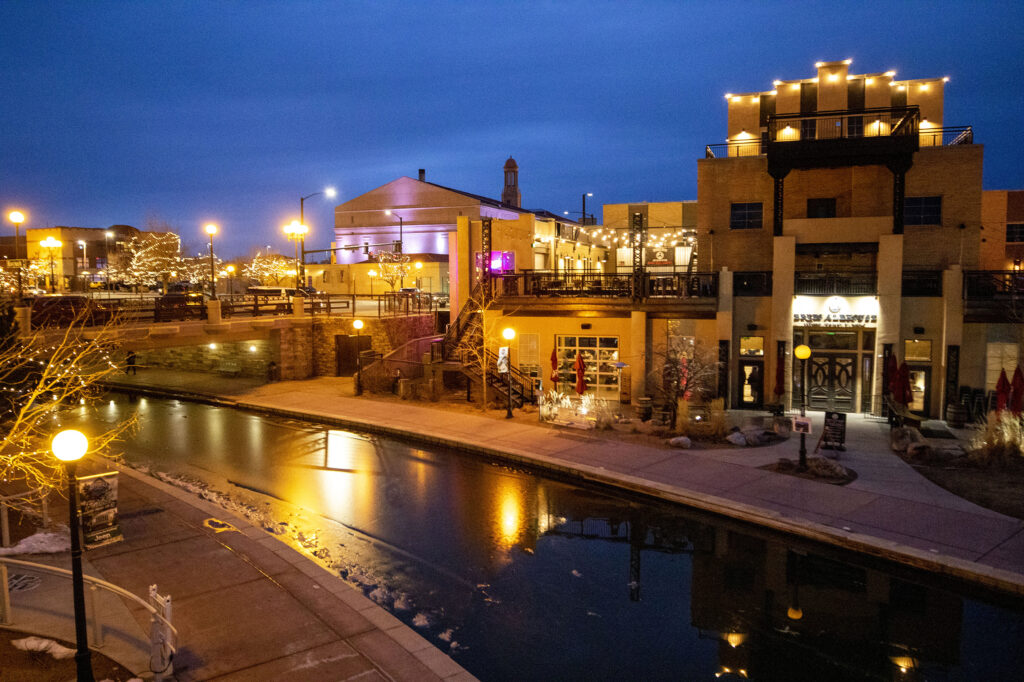 Pueblo | rcastlemortgage.com A beautiful side view of some businesses in Pueblo and their glow illuminating the night sky. Great place for homeowning. Get a quote from Robert Castle Mortgage today.