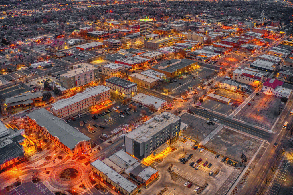 Grand Junction | rcastlemortgage.com Aerial View Of Downtown Grand Junction illuminated by the glow of businesses and streetlights. Great place for homeowning. Get a quote from Robert Castle Mortgage today.